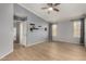 Spacious bedroom with natural light, featuring wood flooring and a ceiling fan at 19833 N 47Th Ln, Glendale, AZ 85308