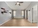 Large bedroom with wood flooring, featuring two windows with natural light and wall decor at 19833 N 47Th Ln, Glendale, AZ 85308