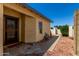 Front exterior of house with desert landscaping and security screen front door at 19833 N 47Th Ln, Glendale, AZ 85308