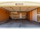 Spacious two-car garage with built-in cabinets and work bench, ready for projects and storage at 19833 N 47Th Ln, Glendale, AZ 85308