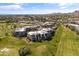 Aerial view of the luxury condos alongside a golf course, offering a blend of upscale living and recreational opportunities at 2 Biltmore Est # 313, Phoenix, AZ 85016