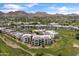 Stunning aerial view highlighting the luxury condo community with golf course frontage and picturesque mountain vistas at 2 Biltmore Est # 313, Phoenix, AZ 85016