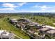 Aerial view showcasing homes within a golf course community with manicured grounds and scenic views at 2 Biltmore Est # 313, Phoenix, AZ 85016