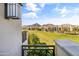 Balcony overlooking lush green golf course and distant mountain views at 2 Biltmore Est # 313, Phoenix, AZ 85016