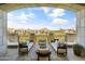 Expansive covered balcony with golf course views, stylish seating, and lounge chairs, ideal for relaxing and entertaining at 2 Biltmore Est # 313, Phoenix, AZ 85016