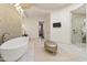 Modern bathroom with a soaking tub, walk-in shower, and sleek design elements at 2 Biltmore Est # 313, Phoenix, AZ 85016