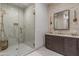 Elegant bathroom with marble vanity, gold fixtures, and glass-enclosed shower at 2 Biltmore Est # 313, Phoenix, AZ 85016