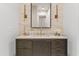Bathroom vanity featuring quartz counters, stylish lighting, and custom wood cabinets at 2 Biltmore Est # 313, Phoenix, AZ 85016