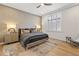 Bedroom with a king bed, stylish rug, wooden floors, and custom window shutters at 2 Biltmore Est # 313, Phoenix, AZ 85016