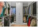 Organized walk-in closet featuring custom shelving and ample storage space for clothing and accessories at 2 Biltmore Est # 313, Phoenix, AZ 85016