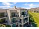 Beautiful exterior view showcasing the condo building's architectural details, spacious balconies, and picturesque golf course views at 2 Biltmore Est # 313, Phoenix, AZ 85016