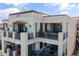 Elegant exterior highlighting multiple balconies perfect for outdoor relaxation, overlooking lush surroundings and golf course views at 2 Biltmore Est # 313, Phoenix, AZ 85016