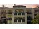Luxury home showcasing multi-level balconies with outdoor seating, offering stunning views and elegant architectural design at 2 Biltmore Est # 313, Phoenix, AZ 85016