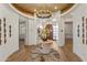 Elegant foyer with decorative chandelier, curved doorways, and stylish accents creating a grand entrance at 2 Biltmore Est # 313, Phoenix, AZ 85016