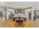 Modern kitchen with stainless steel appliances, center island, and dining area, perfect for cooking and entertaining at 2 Biltmore Est # 313, Phoenix, AZ 85016
