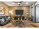 Well-appointed living room with cozy seating arrangement, modern accents and entertainment center at 2 Biltmore Est # 313, Phoenix, AZ 85016
