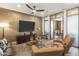 Chic living room featuring designer furnishings, an entertainment center, and an open layout at 2 Biltmore Est # 313, Phoenix, AZ 85016