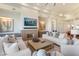 Stylish living room showcasing a modern fireplace, plush sofas, and bright, open space at 2 Biltmore Est # 313, Phoenix, AZ 85016