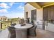 Inviting patio with a dining table, chairs, and outdoor grill featuring scenic views at 2 Biltmore Est # 313, Phoenix, AZ 85016