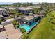 Aerial view of a community pool with an outdoor lounge area and well-maintained landscaping at 2 Biltmore Est # 313, Phoenix, AZ 85016