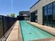 Relaxing community pool with a sleek design and modern architecture, creating a serene oasis for residents at 2 Biltmore Est # 313, Phoenix, AZ 85016