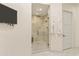 Bathroom shower with glass enclosure and rainfall shower head at 2 Biltmore Est # 313, Phoenix, AZ 85016