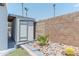 Landscaped backyard featuring desert landscaping, rock features, cacti, and a shed at 2033 E Hillery Dr, Phoenix, AZ 85022