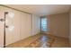 Empty bedroom featuring tile floors and ample natural light, offering a versatile space at 2033 E Hillery Dr, Phoenix, AZ 85022