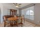 Traditional dining room featuring a wood table set, cabinet, and natural light from the window at 2033 E Hillery Dr, Phoenix, AZ 85022