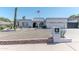 Charming single-story home featuring an arched entryway and low-maintenance desert landscaping at 2033 E Hillery Dr, Phoenix, AZ 85022