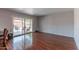 Living area featuring sleek wood floors and sliding glass doors to the outside patio at 2033 E Hillery Dr, Phoenix, AZ 85022