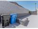 Side yard next to block wall with trash and recycling bins at 2033 E Hillery Dr, Phoenix, AZ 85022