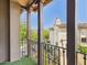 Exterior view from balcony overlooks neighboring property and green space at 20704 N 90Th Pl # 1015, Scottsdale, AZ 85255