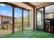 A beautiful balcony features artificial grass, exterior view, and sliding glass door at 20704 N 90Th Pl # 1015, Scottsdale, AZ 85255