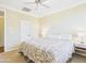 Cozy bedroom features a king bed, ceiling fan, and modern bedside lamps at 20704 N 90Th Pl # 1015, Scottsdale, AZ 85255