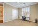 Bedroom with a ceiling fan, shutters, and sliding door closet at 20704 N 90Th Pl # 1015, Scottsdale, AZ 85255