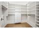 Walk-in closet features ample storage space and neutral carpet at 20704 N 90Th Pl # 1015, Scottsdale, AZ 85255