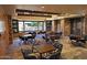 Well-appointed conference room with a large window, seating and stone accent wall at 20704 N 90Th Pl # 1015, Scottsdale, AZ 85255