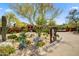 Landscaped entryway to a gated community at 20704 N 90Th Pl # 1015, Scottsdale, AZ 85255