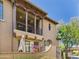 Beautiful two-story home with a balcony, neutral stucco, desert landscape, and a peek of mountain views at 20704 N 90Th Pl # 1015, Scottsdale, AZ 85255