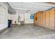 Spacious garage with ample storage, epoxy floors, water heater, and access to backyard, perfect for vehicles and projects at 20704 N 90Th Pl # 1015, Scottsdale, AZ 85255