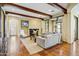 Bright living room features wood beam ceiling, fireplace, and modern decor at 20704 N 90Th Pl # 1015, Scottsdale, AZ 85255