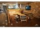 Cozy lounge area with stone accent walls, modern furniture and natural light at 20704 N 90Th Pl # 1015, Scottsdale, AZ 85255