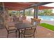 Outdoor seating area with tables and chairs next to the sparkling pool at 20704 N 90Th Pl # 1015, Scottsdale, AZ 85255
