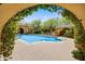 Community pool and spa with covered patios and landscaping at 20704 N 90Th Pl # 1015, Scottsdale, AZ 85255