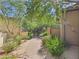 Paver walkway between tan stucco homes with mature landscaping at 20704 N 90Th Pl # 1015, Scottsdale, AZ 85255