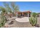 Inviting backyard with desert landscaping and covered patio area at 20739 N 106Th Ln, Peoria, AZ 85382