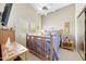 Cozy bedroom featuring a vaulted ceiling, natural light, and mirrored closet doors at 20739 N 106Th Ln, Peoria, AZ 85382