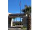 Ventana Lakes entrance featuring desert landscaping, signage, and an American flag at 20739 N 106Th Ln, Peoria, AZ 85382