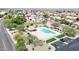 A refreshing community pool and spa area surrounded by mature trees and landscaping at 20739 N 106Th Ln, Peoria, AZ 85382